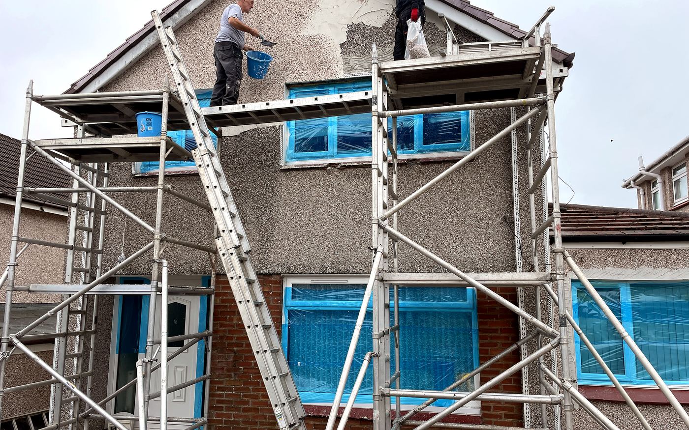 The Jaconelli Builders team applying render on site