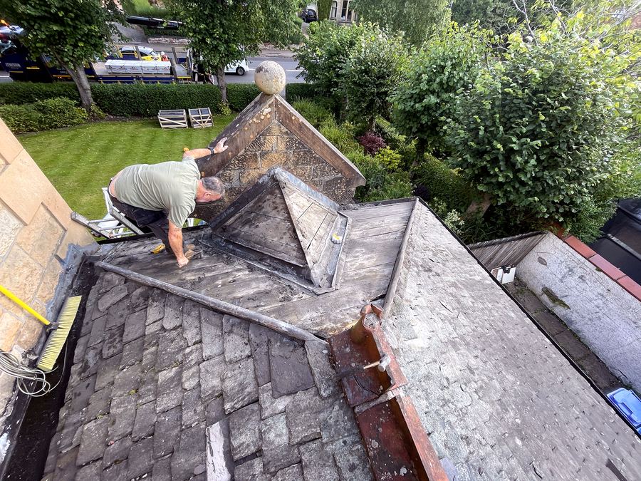 Jaconelli Builders working on a chimney at roof height