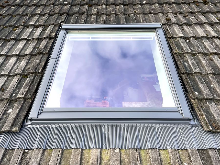 Velux rooflight fitted into a tiled roof